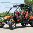 Load image into Gallery viewer, Orange off-road dune buggy with four seats parked on a sunny street with trees and power lines in the background.